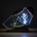 Two of Us resin lamp glowing in a dark room