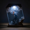 Her Song resin lamp glowing in a dark room